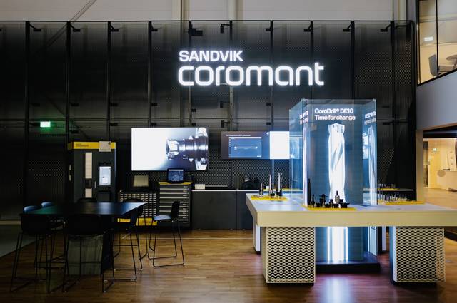 Interior view of the Sandvik Coromant Center, featuring modern digital displays and machining tool s